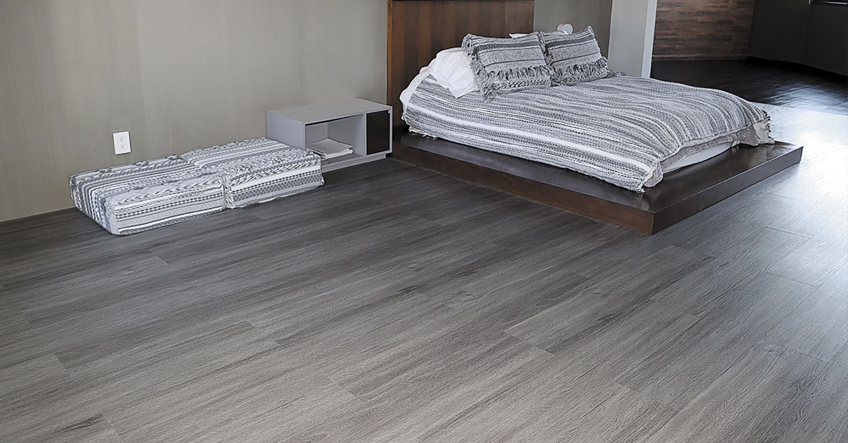 dormitorio con piso Lalur color gris